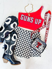 Guns UP one shoulder